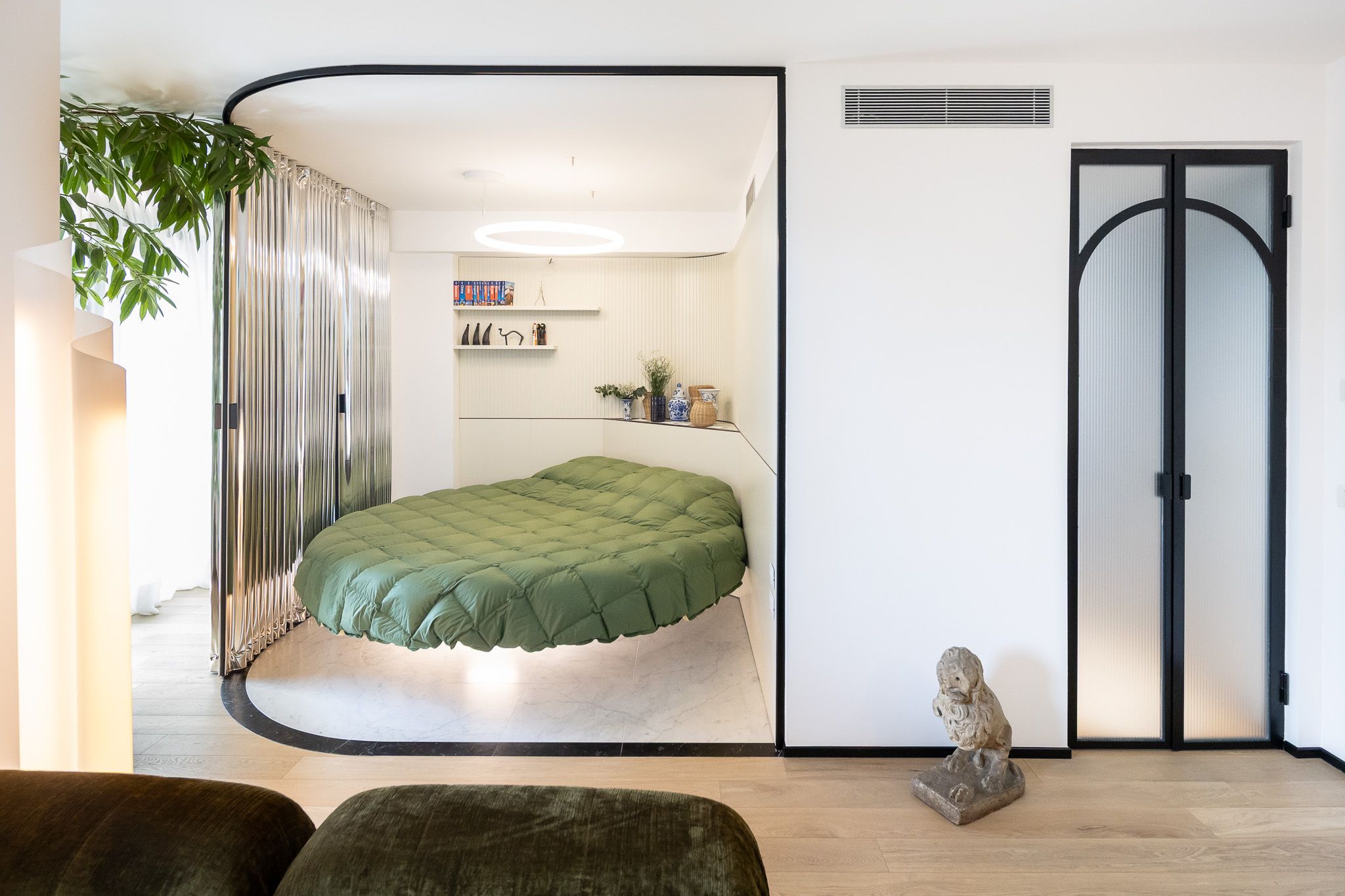 The Star of This 968-Square-Foot Milan Apartment Is a Disappearing Bed