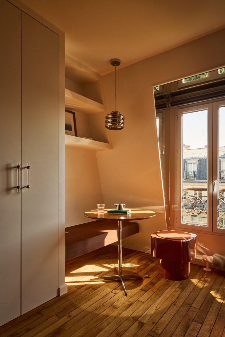 This 161 Square-Foot Attic in Paris Boasts Budget Mahogany Panels and Versatile Furniture